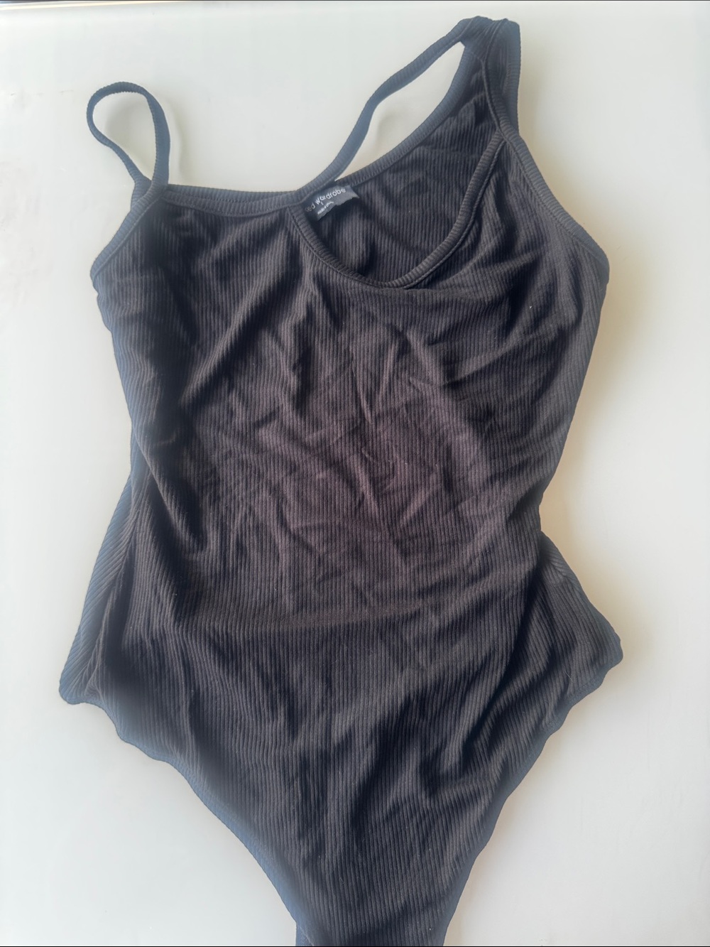 naked wardrobe Black asymmetrical neck Ribbed Tank Bodysuit - NWOT
